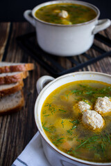 Soup close-up. Soup with meatballs. On a wooden background.
