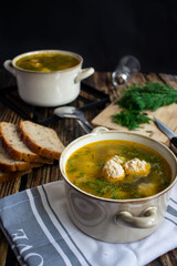 Soup close-up. Soup with meatballs. On a wooden background.