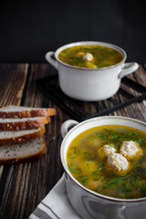 Soup close-up. Soup with meatballs. On a wooden background.