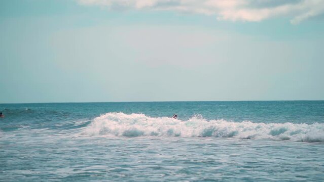 Slow Motion Surfer wiping out on small wave