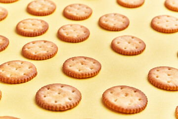  Delicious group of salty biscuits over isolated yellow background
