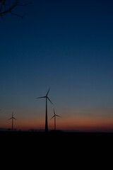 Obraz premium wind turbine at sunset