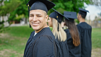 Group of people students graduated smiling confident standing together at university campus