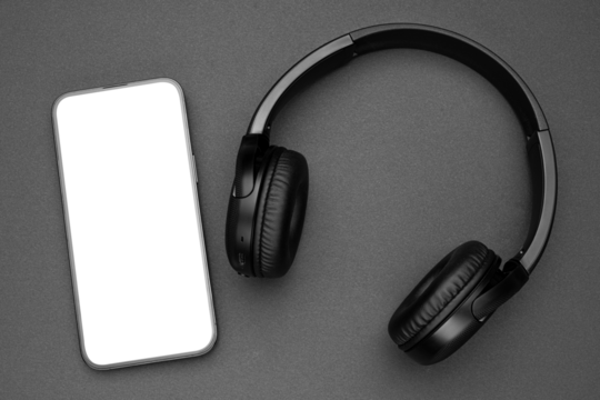 Mockup display. Mobile cell phone blank screen. Black headphones for listening audio music. Smartphone technology. Office workplace. Smart phone. Mock up device for application, website design project