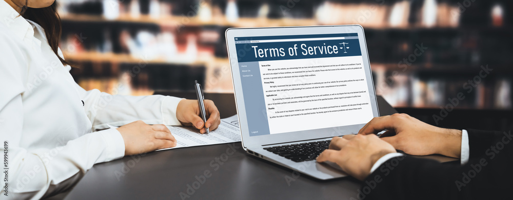 Poster online term of service conditions showing astute rules and regulations in using the website on a lap