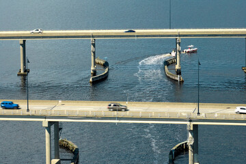 Barron Collier Bridge and Gilchrist Bridge in Florida with moving traffic. Transportation...