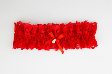 Red garter isolated on white background - obrazy, fototapety, plakaty