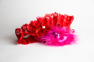 Red-pink garter isolated on white background - obrazy, fototapety, plakaty