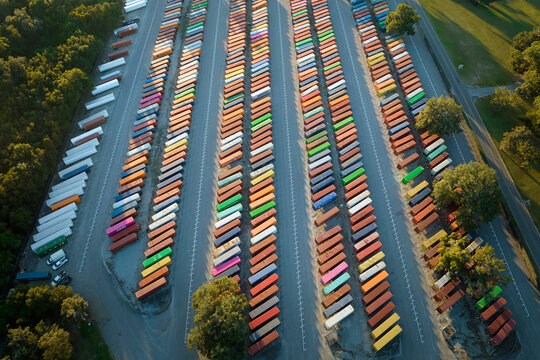 View from above of cargo container industrial yard with many shipment freight containers. Concept of international delivery of goods