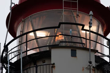 Foto auf Acrylglas close up of the red lighthouse in Schiermonnikoog an island of the dutch wadden islands © Daniel Doorakkers