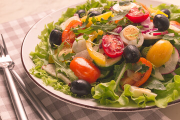 Vegetable salad , with quail eggs and olives, fresh, close-up, no people,
