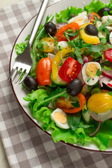 Vegetable salad , with quail eggs and olives, fresh, close-up, no people,