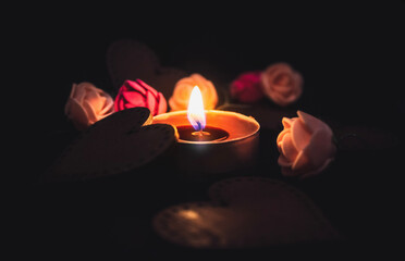 Burning candle in the dark