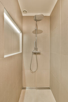 a walk in shower that is very clean and ready to be used for the next day's wash up