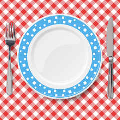 Blue dish with pattern of chaotic white pattern placed on red check classic table cloth