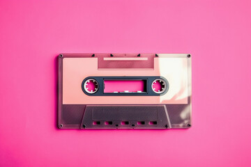 Fototapeta premium Retro cassette tape on pink background