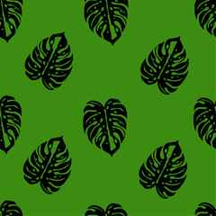 monstera leaf pattern on green background