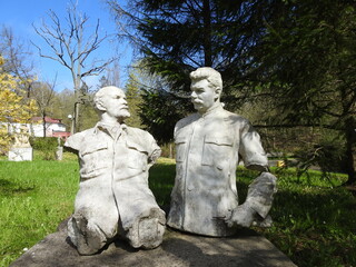 the half-ruined statue of lenin and stalin in the outdoor museum near kaliningrad, russia