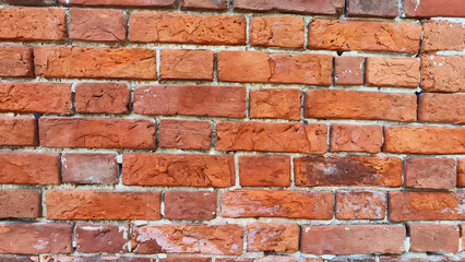 Texture, background and frame made of abstract red brick. Brickwork wall