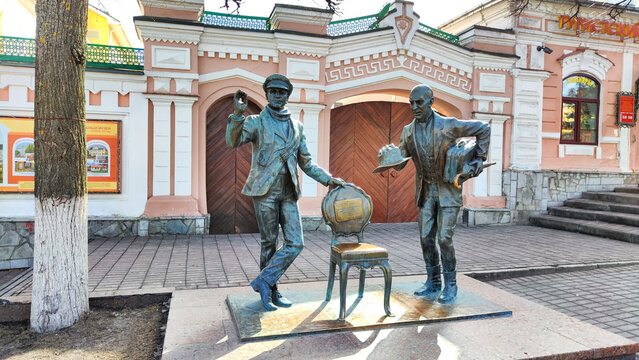 Cheboksary, Russia - April 05, 2023: Sculpture of Ostap Bender and Kisa Vorobyaninov on the street in sunny day. Attraction of the city