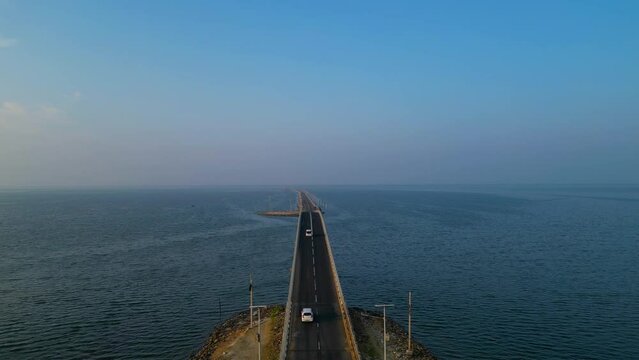 aerial footage of a long bridge connecting islands in mid of ocean