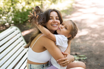 Closeup Mother and daughter playing in public park together. Family leisure sport activity weekend....