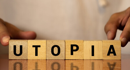 word UTOPIA on wooden block, concept image