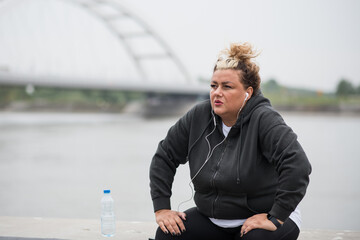 Obese woman resting after her morning exercise.