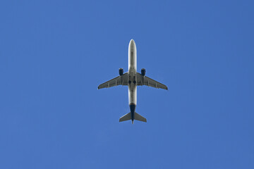 Airplane in Bright Blue Sky