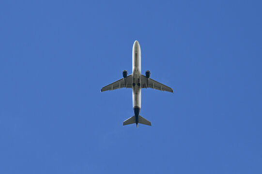 Airplane in Bright Blue Sky