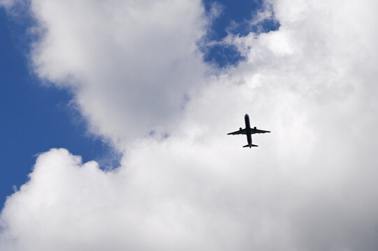 Airplane in Cloudy Sky