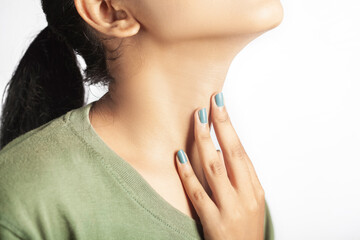 closeup view of a women showing thyroid or throat pain