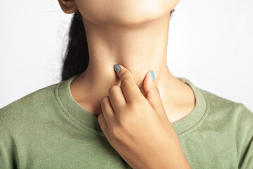 closeup shot of a women suffering from thyroid, tonsil or throat soreness - obrazy, fototapety, plakaty