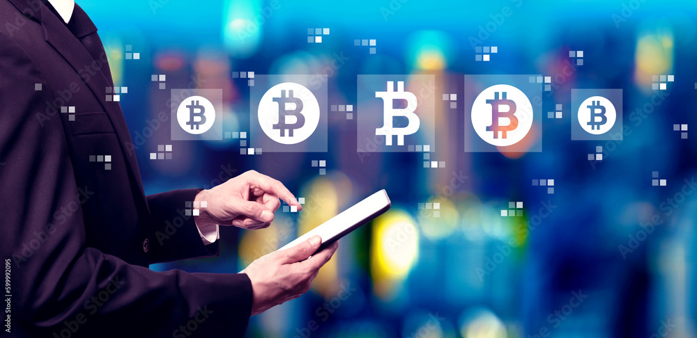 Poster bitcoin theme with businessman using a tablet computer at night