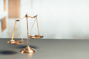 Shiny golden balanced scale in court library background as concept justice and fairness legal symbol. Scale balance for righteous and equality judgment by lawyer and attorney. equility - obrazy, fototapety, plakaty