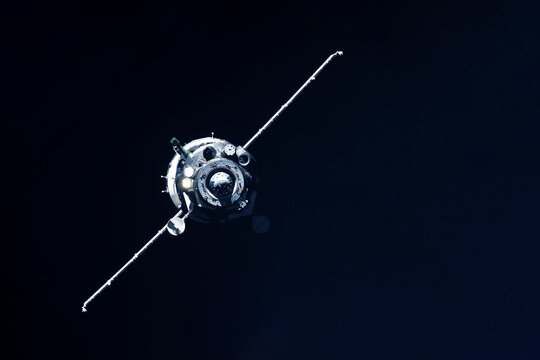 Docking spacecraft in outer space. Elements of this image furnished NASA.