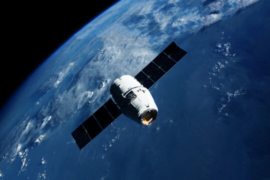 Docking spacecraft in outer space. Elements of this image furnished NASA. - Powered by Adobe
