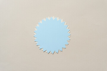 isolated blue stylized or abstract representation of a flower or floral emblem or badge with...