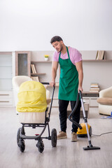 Young male contractor cleaner looking after newborn