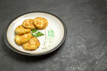 front view delicious cooked squashes slices inside plate on a dark grey background vegetables meal food dinner squash