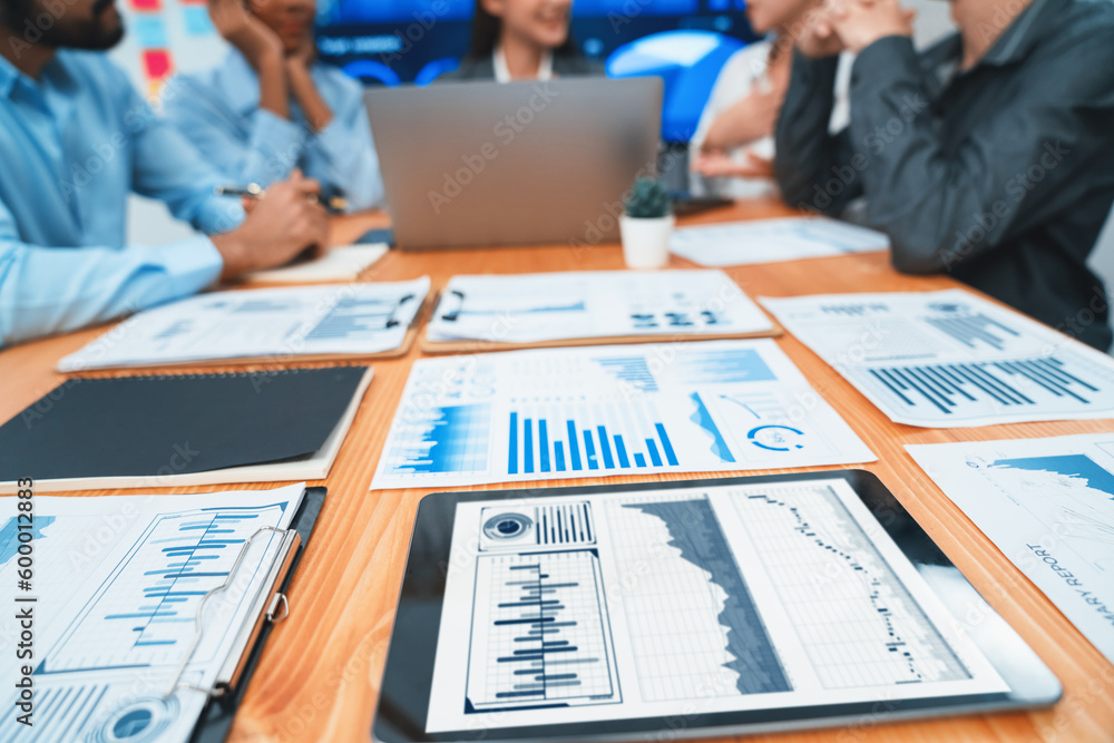 Aufkleber focus financial dashboard paper showing graphs and chart with blurred background of diverse business