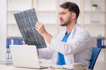 Young male doctor radiologist working in the clinic