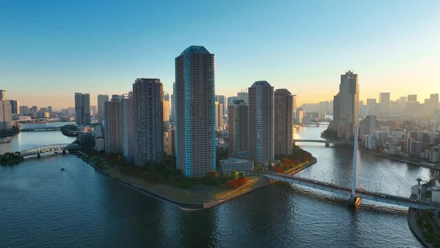 aerial view of Tokyo city at sunrise, modern skyscrapers near Sumida River in Tokyo in Japan, Asian metropolis business district
