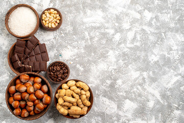top view chocolate bars with hazelnuts and peanuts on white background peanut nut snack food