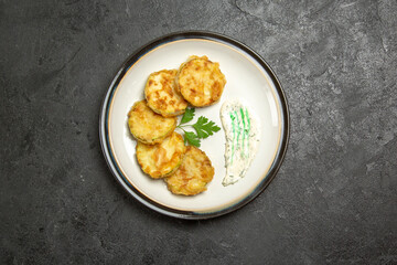 top view cooked squashes slices inside plate on grey background vegetables meal food cooking dinner squash
