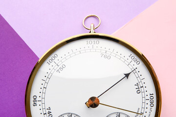 Aneroid barometer on colorful background