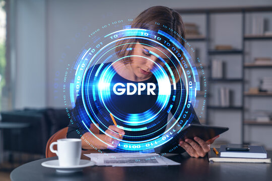 Businesswoman holding tablet device, touching screen. Office workplace. Concept of infromation security, distant work, business education, information technology.