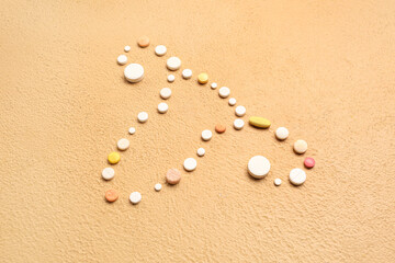 Fototapeta na wymiar Uterus made of pills on beige background. Hormones concept
