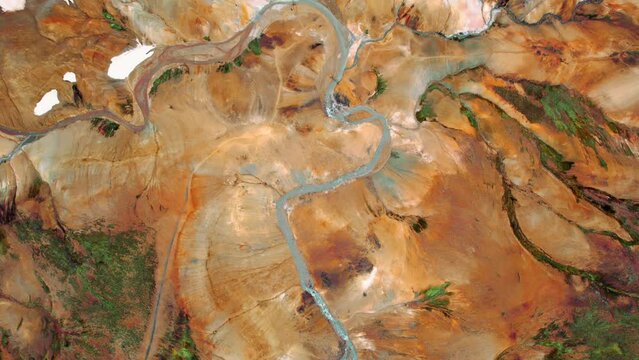 Aerial drone footage of Kerlingarfjoll geothermal area with mountains and windy river in Iceland Highlands. Famous tourist attraction and landmark destination in Icelandic nature. Bird's eye view pt 2