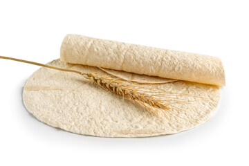 Thin lavash and wheat spikelet on white background